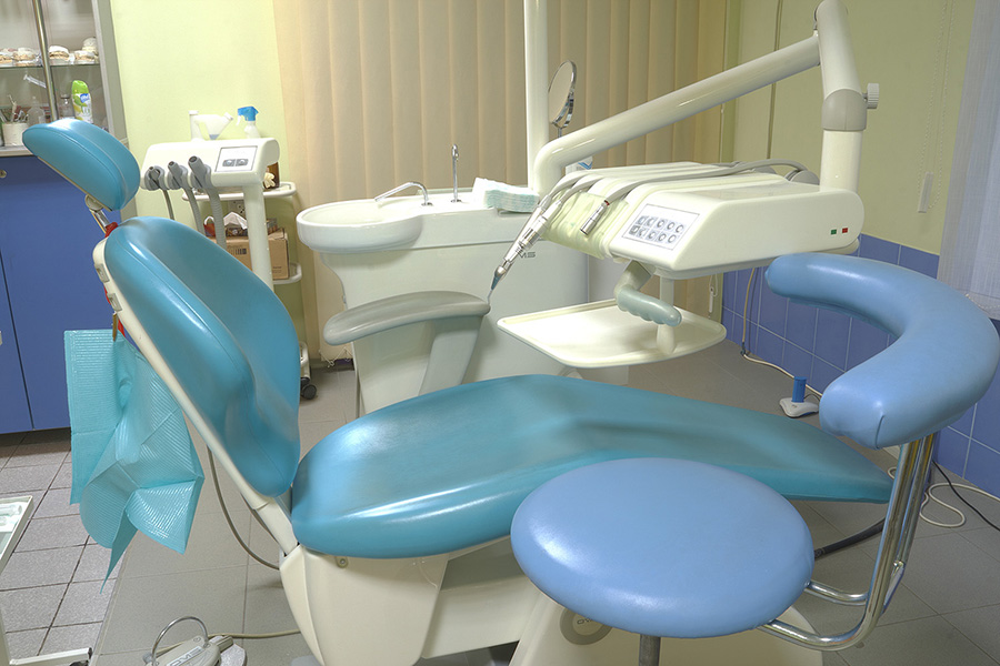 Modern dentist’s chair in a medical room. - Baker Family Dentistry ...